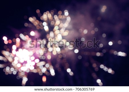 Blurred bright bokeh festive fireworks against the background of the night sky. Pictures from series. Christmas and New Year Holiday firework. Bright abstract background ideal for any design     
