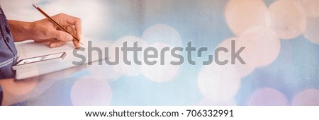 Digital composite of Hand Signing Paper Agreement with sparkling lights bokeh transition