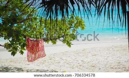Orange cloth on the tree ,beach backgrounds