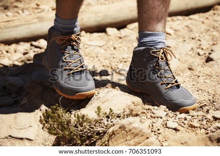 Hiker's boots on the move on trail, close up