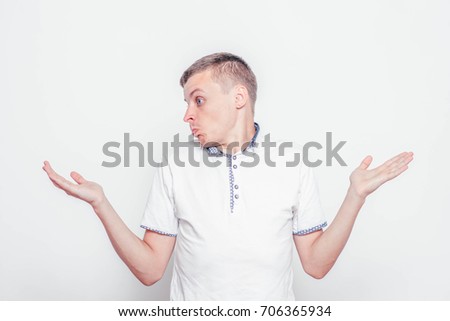 Portrait of confused technician giving I dont know gesture on white background