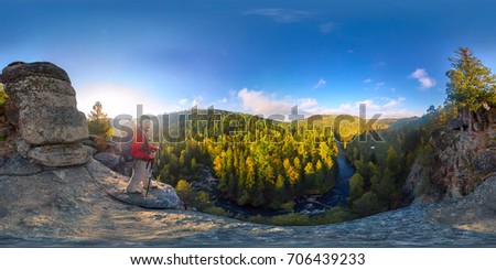 Backpacker on top of a rock fall at dawn. Spherical panorama 360 180 degrees equidistant. Royalty-Free Stock Photo #706439233
