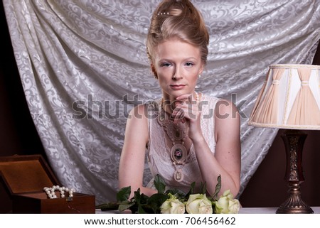 Beautiful gorgeous woman in victorian style in studio photo. Luxury and elegance