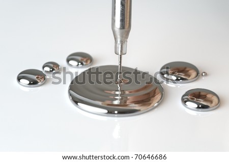 Mercury pouring from a pipette Royalty-Free Stock Photo #70646686