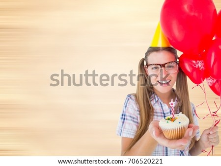Digital composite of Millennial woman with balloons and cupcake against blurry cream background