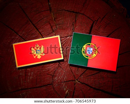 Montenegrin flag with Portuguese flag on a tree stump isolated