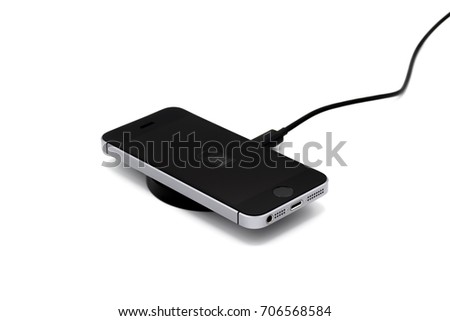 close up the Smart phone via Wireless Charging on white background