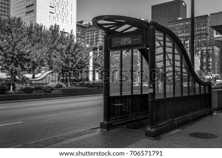 Subway entrance in urban setting with sky