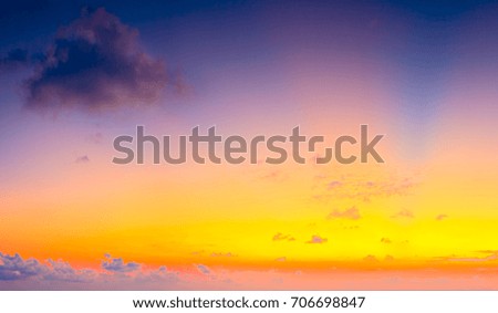 Beautiful colorful sunrise with dramatic clouds and sun shining in vintage style panorama