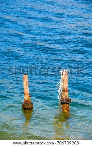 pillars in water close up photo italy