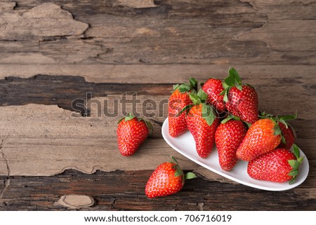 Strawberry fruit on old brown old wood background.