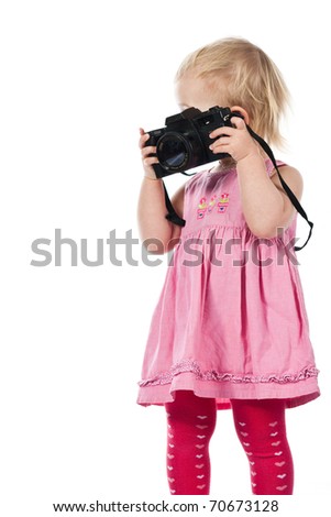Child playing a photographer isolated on white