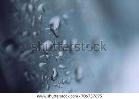 Beads of water on a black background