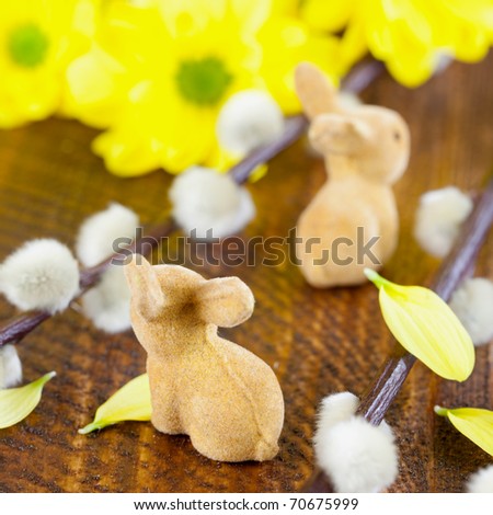 easter rabbits with pussy willow on table