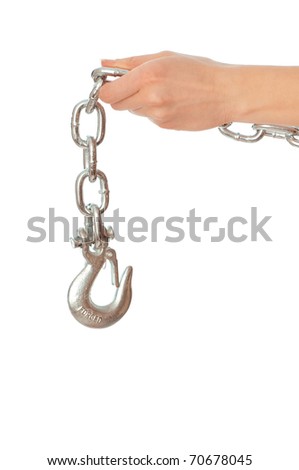 chain with a hook in the hands of crane operator at construction site