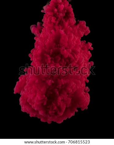 The cloud of red paint in the dark water.