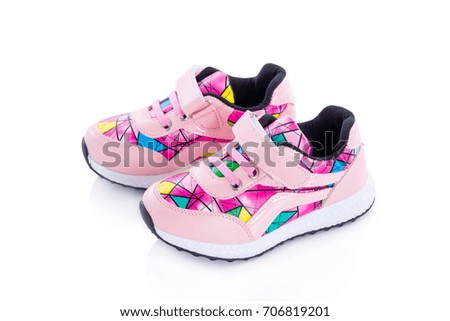 Pink color sport shoes isolated over white background