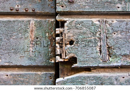 Closure of an old wooden door of a historic dwelling
