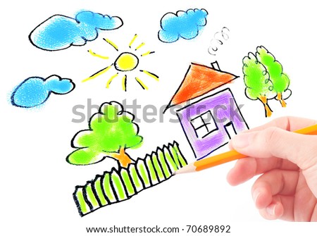 woman's hand with the pencil and brushes drawing the dream home on a white sheet of paper