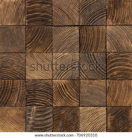 Brown end grain wood texture. Cross cut lumber blocks. Royalty-Free Stock Photo #706920310