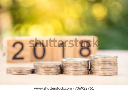 Coins stacks with wooden block 2018 text as background, success, dealing, business planner, forecast concept.