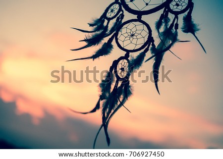 Dream Catcher on the sunset background Royalty-Free Stock Photo #706927450