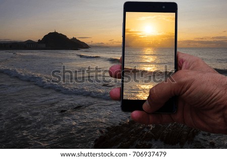 Photo with a smartphone the city of San Sebastian in the holidays
