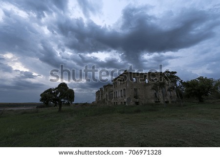 Ruins of the old castle and storm sky 