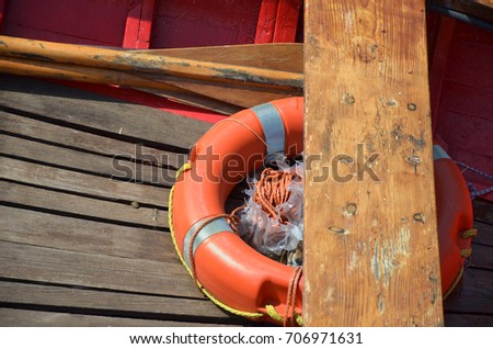 boat rescue tire in color red close up photo