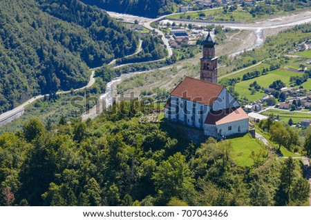 Aerial photograph of a church on a hill in the Friulian Alps, northern Italy