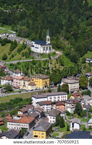 Aerial photo of a population with church, in the region of the Alps Friuli, Italy