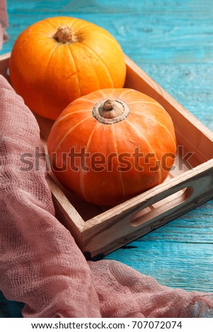 Blue table with pumpkin, cloth