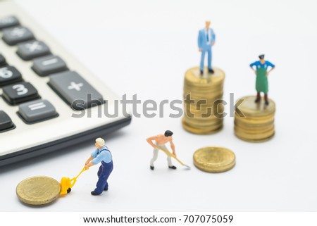 Worker removing coins  with background of  Businessman standing on coins stacks ,business concept  and Isolated on white background  ,Miniature people 
 removing coins and standing on coins stacks.