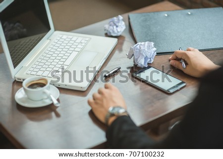 Cropped image of professional businesswoman working at her office via laptop, young female manager using portable computer device while sitting at modern loft, flare light, work process concept.