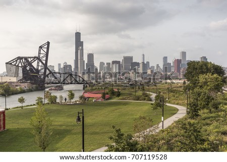 Chicago skyline with park and leading path with clouds