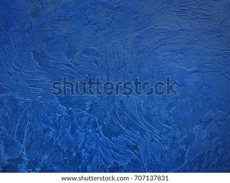 Textured blue grunge background. Dark crumpled texture. 