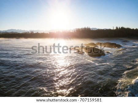Aerial view on the beautiful rocky ocean landscape during morning sunrise. Picture taken near Tofino and Ucluelet, Vancouver Island, British Columbia, Canada.
