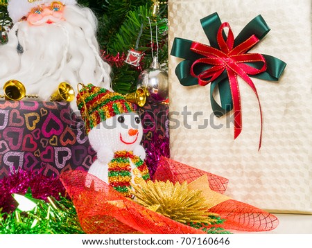 Snow man and accessories decorated with Christmas tree