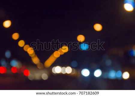 Traffic light on the road at night abstract blurred bokeh background 