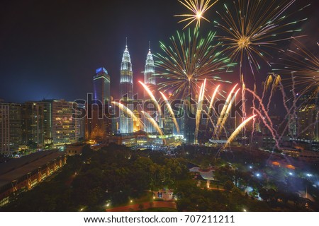 Fireworks display show over Kuala Lumpur city skyline Royalty-Free Stock Photo #707211211