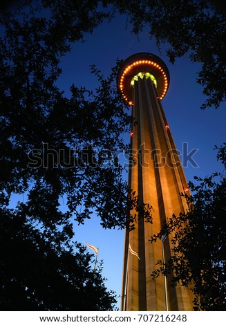 The tower of the Americas stands guard over Hemisfair park in San Antonio Texas viewed in a unique and beautiful angle at the peak of the blue hour