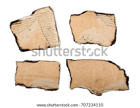 Burnt cardboard scraps isolated on white background