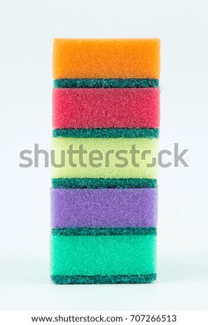 Multicolored sponges for washing dishes on white isolated background