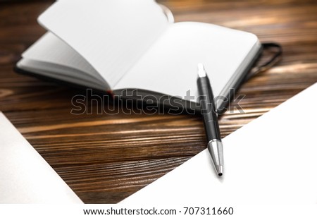 Blank notepad and pen on office background . Business concept with copy space and place for text for any design