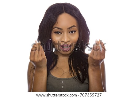 Black female isolated on a white background displaying money gesture and expressions.  She is young and of African American ethnicity.