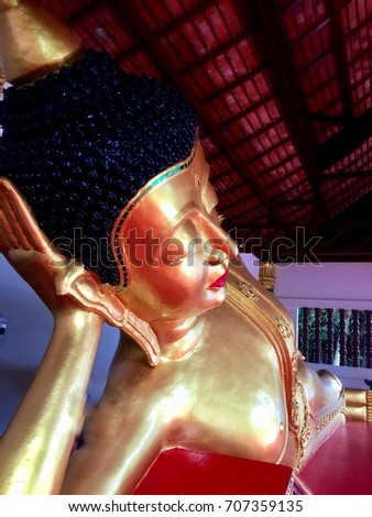 The Reclining Buddha at temple in Chiang Mai , Thailand