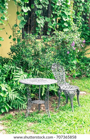 vintage outdoor patio chair in the garden - vintage effect filter