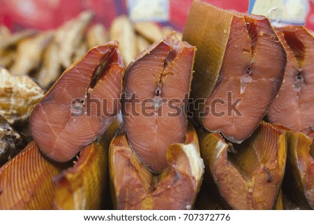 Drying Salmon at food market - agricultural exhibition