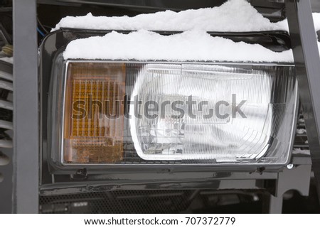 Headlight of a truck on the frozen winter ourdoor - cold outdoor