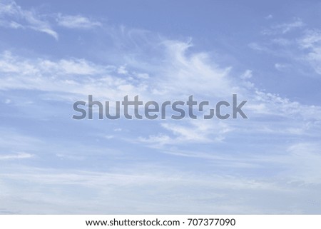 Blue sky and soft white clouds background and empty space for your design.
